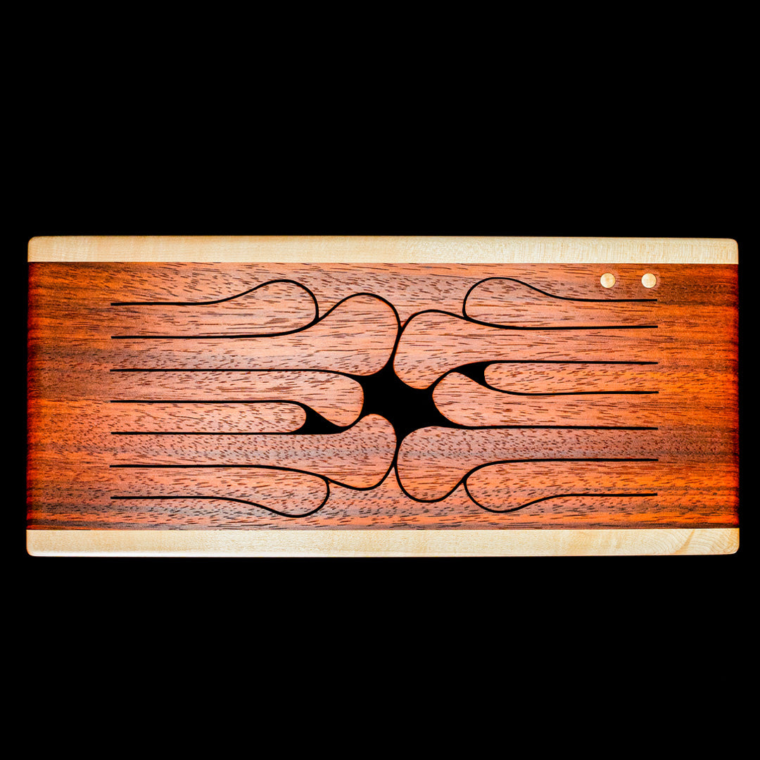 Top view of 12-key wooden tongue drum in padauk with curved tongues