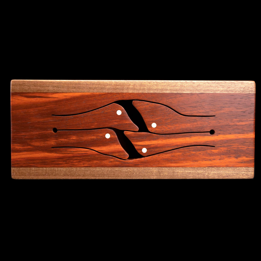 Top view of 4-key wooden tongue drum in maple with bird-shaped tongues