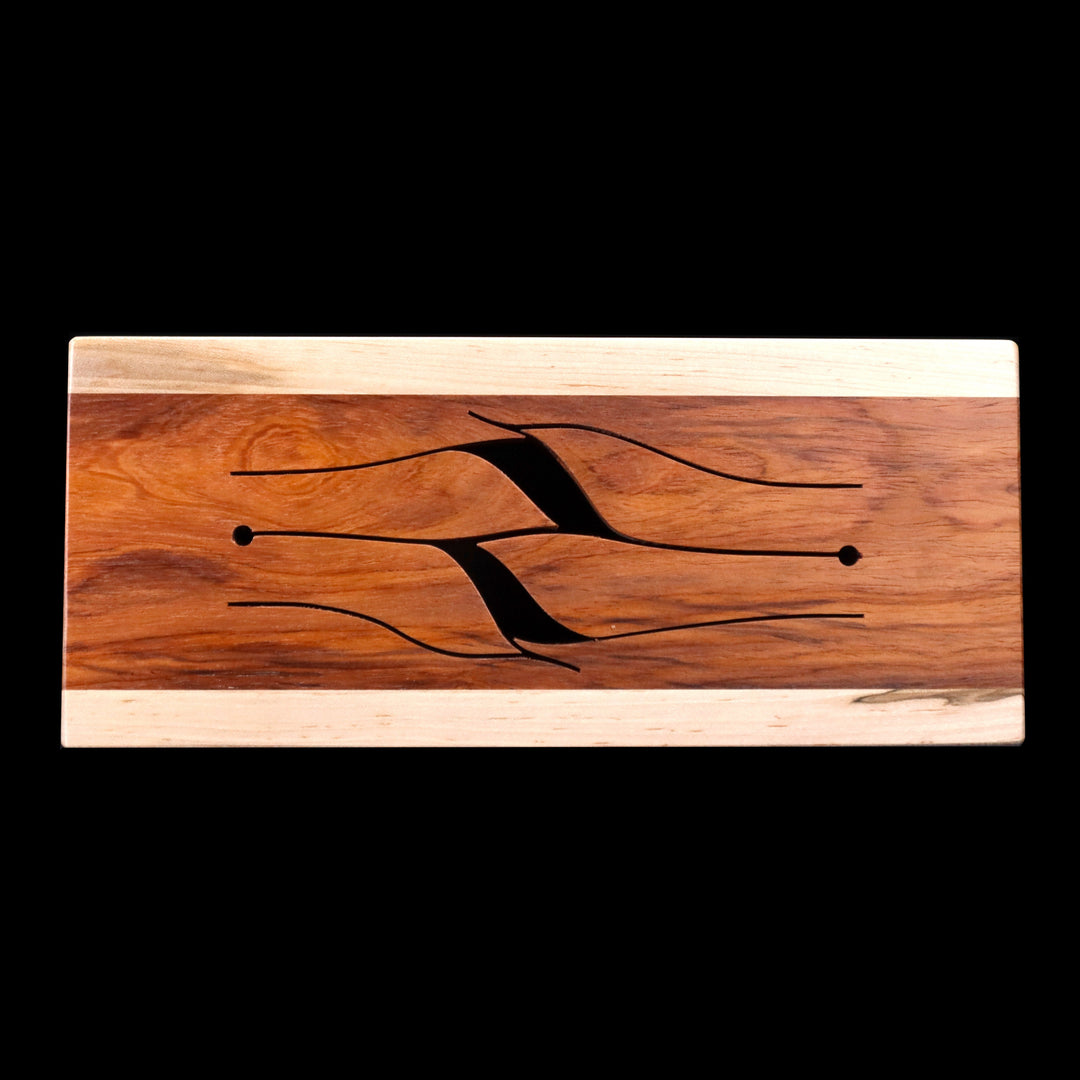 Top view of 4-key wooden tongue drum in maple with ivy-shaped tongues