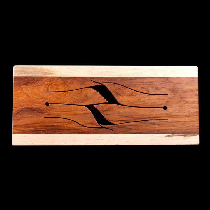Top view of 4-key wooden tongue drum in maple with ivy-shaped tongues